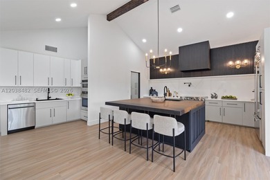 Located in Boca Grove, this charming remodel features a - photo 11