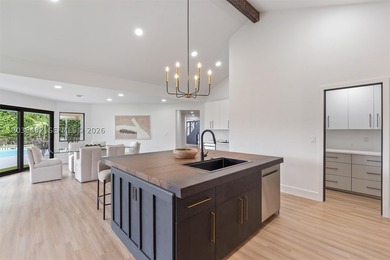 Located in Boca Grove, this charming remodel features a - photo 12