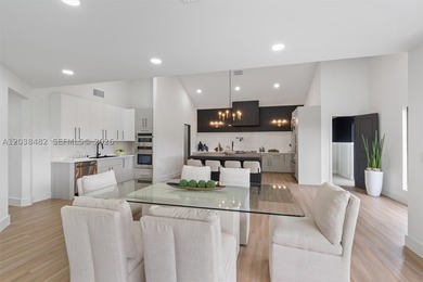 Located in Boca Grove, this charming remodel features a - photo 13