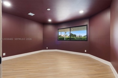 Located in Boca Grove, this charming remodel features a - photo 15