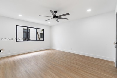 Located in Boca Grove, this charming remodel features a - photo 16