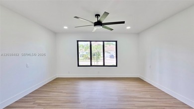 Located in Boca Grove, this charming remodel features a - photo 18