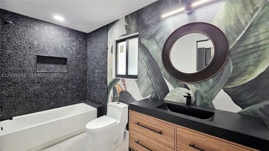 Located in Boca Grove, this charming remodel features a - photo 19