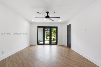 Located in Boca Grove, this charming remodel features a - photo 20