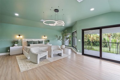 Located in Boca Grove, this charming remodel features a - photo 23