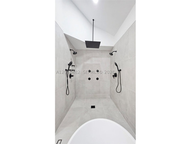 Located in Boca Grove, this charming remodel features a - photo 27
