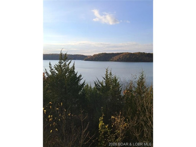 Wake up each day to breathtaking panoramic lake views from this - photo 8