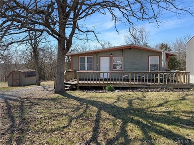 Enjoy the ease of lake living in this updated home with a swim - photo 1
