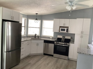 This home comes with recent updates: a less than a year old - photo 3