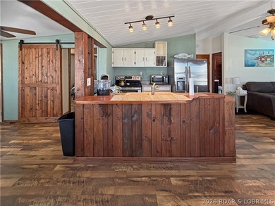 Enjoy the ease of lake living in this updated home with a swim - photo 5