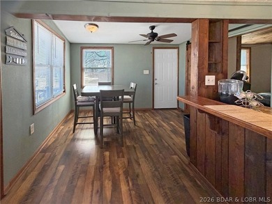 Enjoy the ease of lake living in this updated home with a swim - photo 7