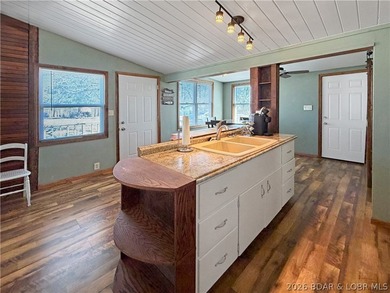 Enjoy the ease of lake living in this updated home with a swim - photo 8