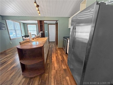Enjoy the ease of lake living in this updated home with a swim - photo 9