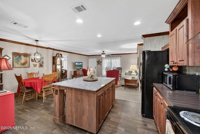 Welcome home to this beautifully maintained 2019 manufactured - photo 15
