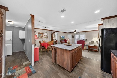 Welcome home to this beautifully maintained 2019 manufactured - photo 16