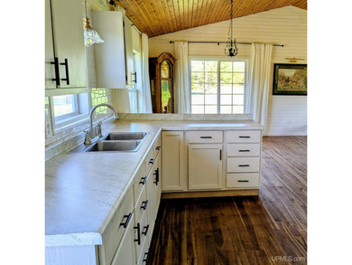 Set on 17 scenic acres in Michigan's Upper Peninsula, this - photo 6