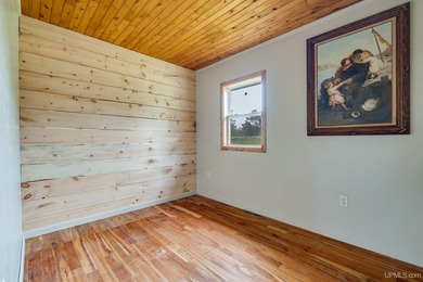 Set on 17 scenic acres in Michigan's Upper Peninsula, this - photo 10