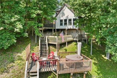 Discover peace and tranquility in this stunning lakefront home - photo 2