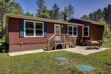 Nestled among the pines just minutes from Lower Post Lake in - photo 31