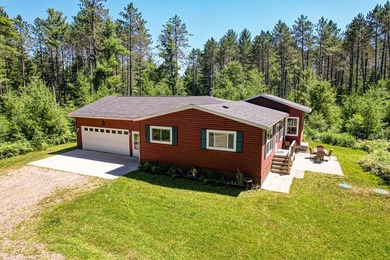 Nestled among the pines just minutes from Lower Post Lake in - photo 32