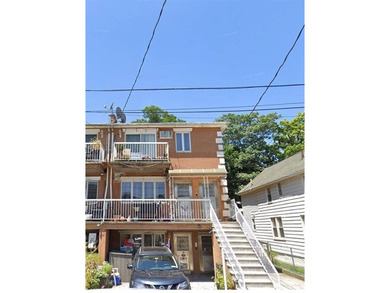 In the heart of Bensonhurst, a three-story solid brick building - photo 1