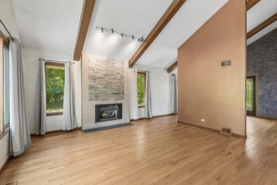 This contemporary 5-bedroom, 2.5-bath home sits on 1.4 wooded - photo 4