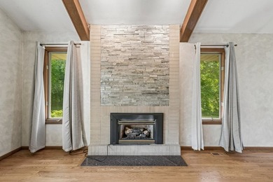 This contemporary 5-bedroom, 2.5-bath home sits on 1.4 wooded - photo 5