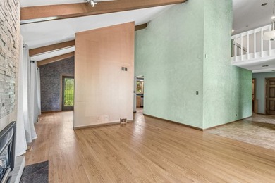 This contemporary 5-bedroom, 2.5-bath home sits on 1.4 wooded - photo 6