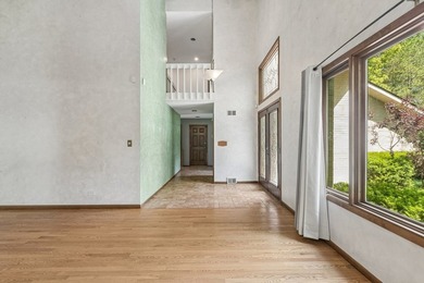This contemporary 5-bedroom, 2.5-bath home sits on 1.4 wooded - photo 7