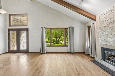 This contemporary 5-bedroom, 2.5-bath home sits on 1.4 wooded - photo 8