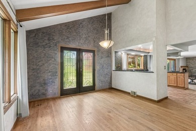 This contemporary 5-bedroom, 2.5-bath home sits on 1.4 wooded - photo 9