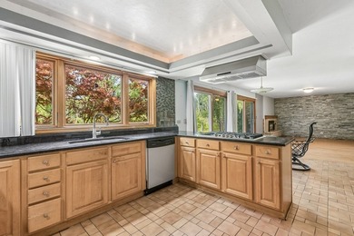 This contemporary 5-bedroom, 2.5-bath home sits on 1.4 wooded - photo 10