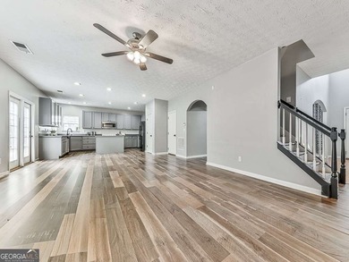 Lake & Golf Cart Living! This beautiful, spacious home offers 5