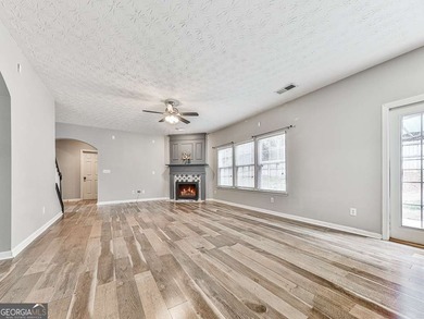 Lake & Golf Cart Living! This beautiful, spacious home offers 5