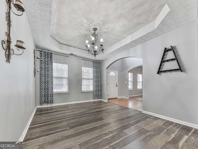 Lake & Golf Cart Living! This beautiful, spacious home offers 5