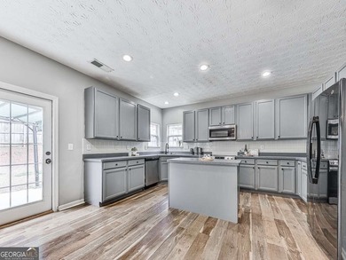 Lake & Golf Cart Living! This beautiful, spacious home offers 5