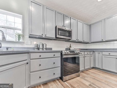 Lake & Golf Cart Living! This beautiful, spacious home offers 5