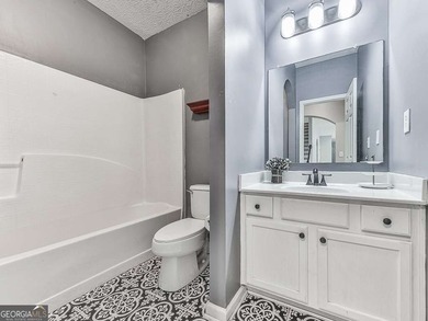 Lake & Golf Cart Living! This beautiful, spacious home offers 5