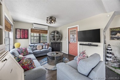 Freshly remodeled, this charming A-frame instantly feels like a - photo 4