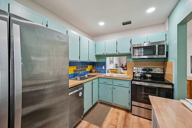Welcome home to this charming 1-bedroom,1.5-bath VILLA located - photo 12