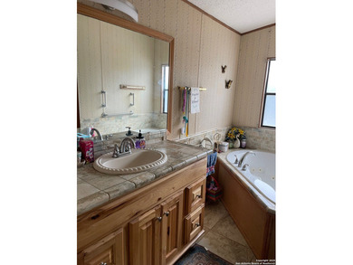 Peaceful country living with two homes on this 8.5 acres. Main