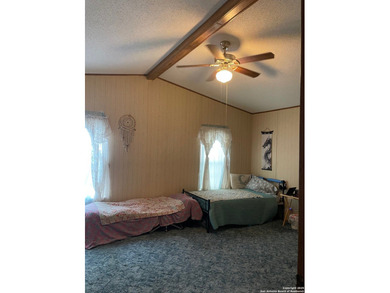 Peaceful country living with two homes on this 8.5 acres. Main