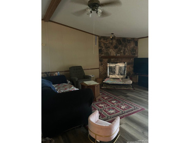 Peaceful country living with two homes on this 8.5 acres. Main