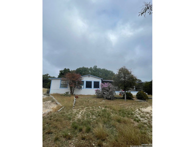 Peaceful country living with two homes on this 8.5 acres. Main