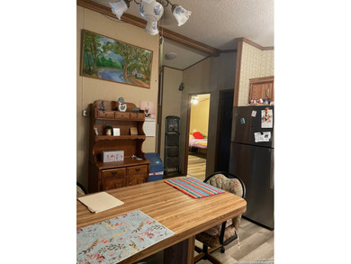 Peaceful country living with two homes on this 8.5 acres. Main