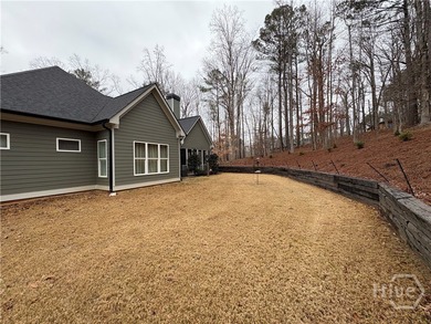 Tucked away on a serene two-acre wooded lot, this stunning