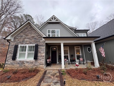 Tucked away on a serene two-acre wooded lot, this stunning