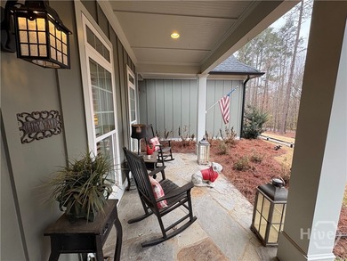 Tucked away on a serene two-acre wooded lot, this stunning