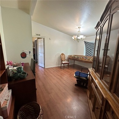 This property features a charming 3-bedroom, 2-bath manufactured - photo 12