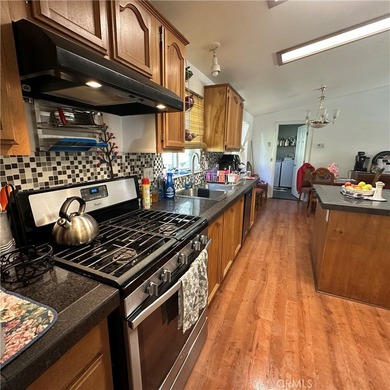 This property features a charming 3-bedroom, 2-bath manufactured - photo 15
